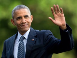 FILE - In this July 5, 2016 photo, President Barack Obama waves as he walks across the South Lawn of the White House, in Washington, as he returns from Charlotte, N.C. where he participated in a campaign event with Democratic presidential candidate Hillary Clinton. Obama is interrupting his summer vacation to do some campaigning for Hillary Clinton, the Democratic presidential nominee. Obama is slated to headline a Democratic Party reception Monday, Aug. 15, 2016, on Martha's Vineyard, the tony Massachusetts island where he's been vacationing with his family. (AP Photo/Carolyn Kaster, File)